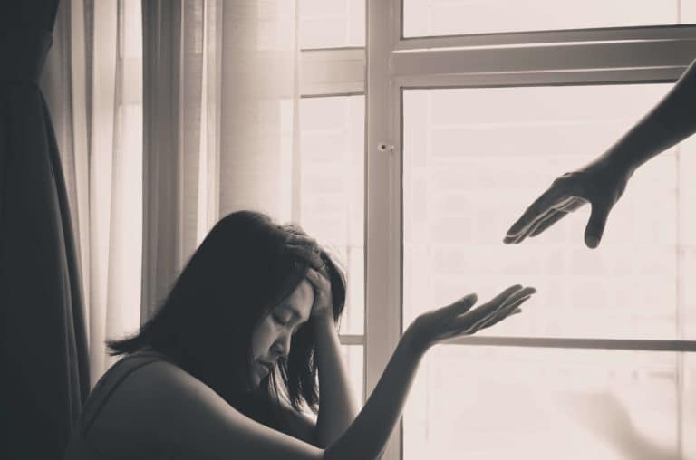 woman struggling with addiction being supported