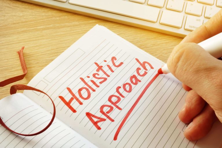 holistic approach written in a notebook
