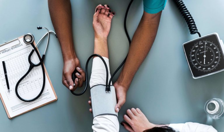 doctor evaluating patient during medication assisted treatment